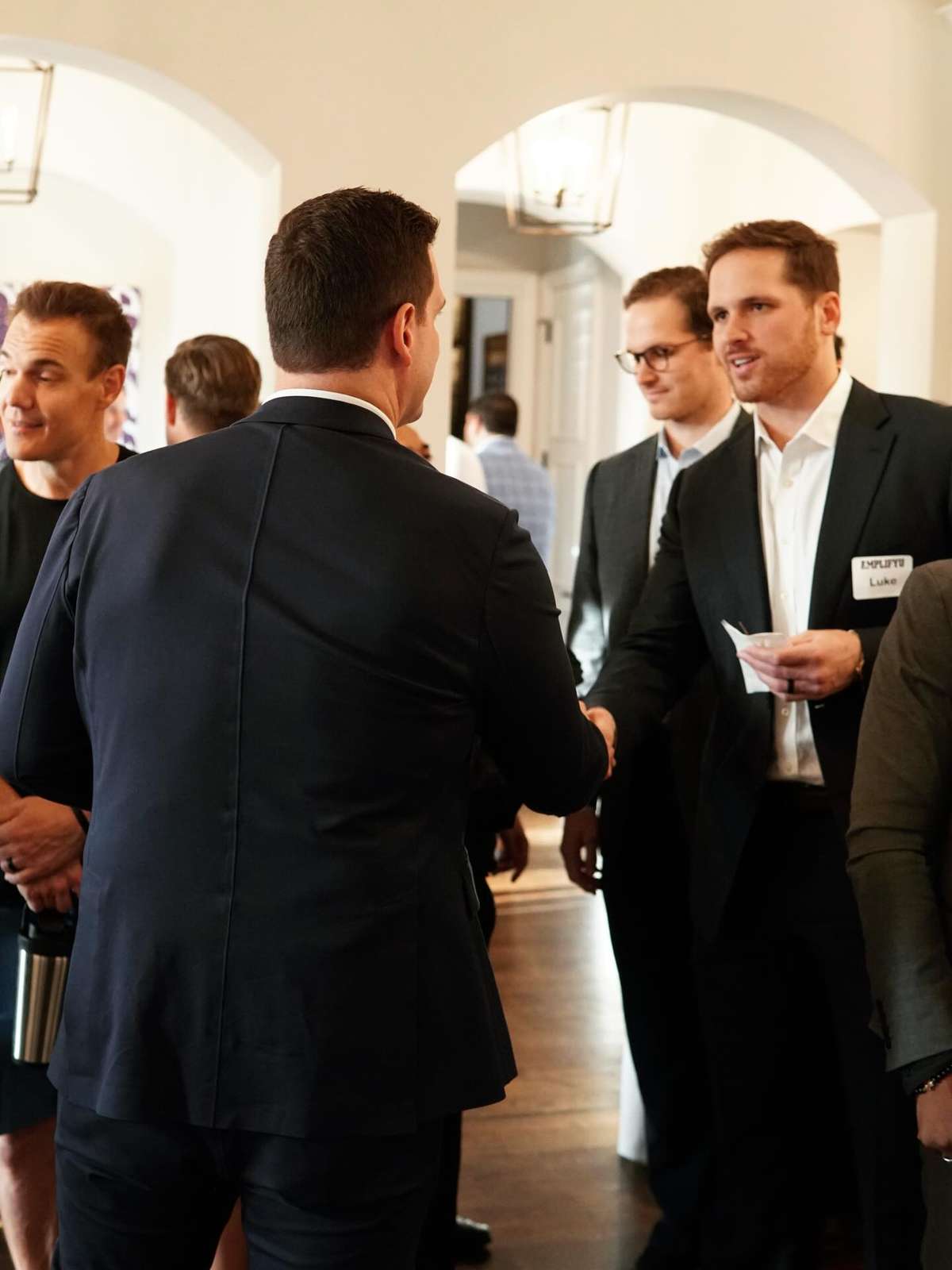 Guests connecting at a formal DFW event