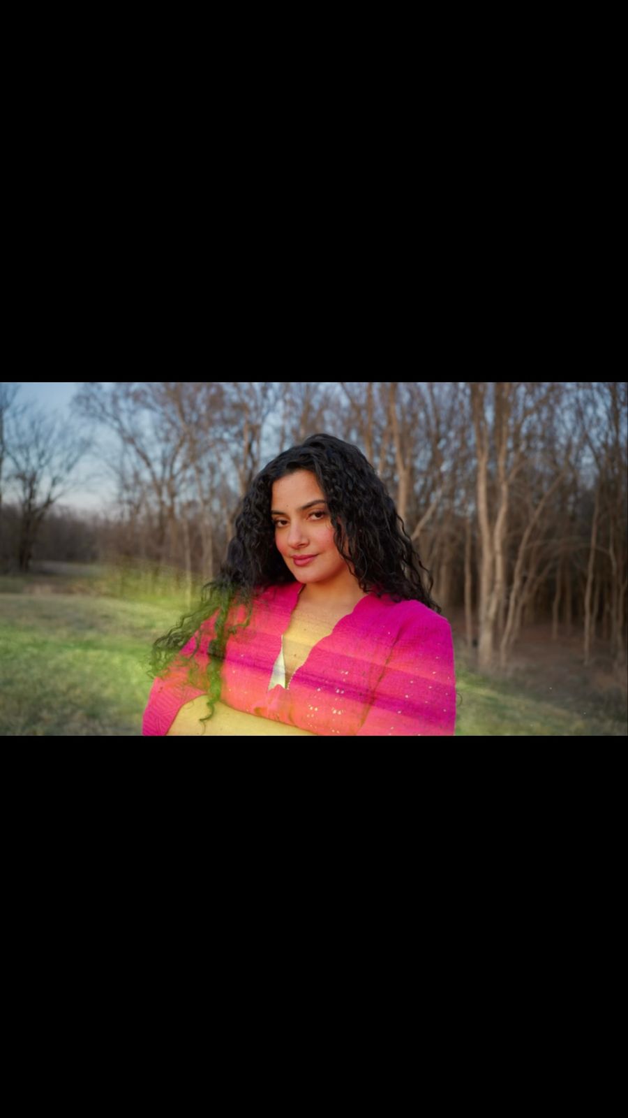 Woman framed in cinematic color and contrast